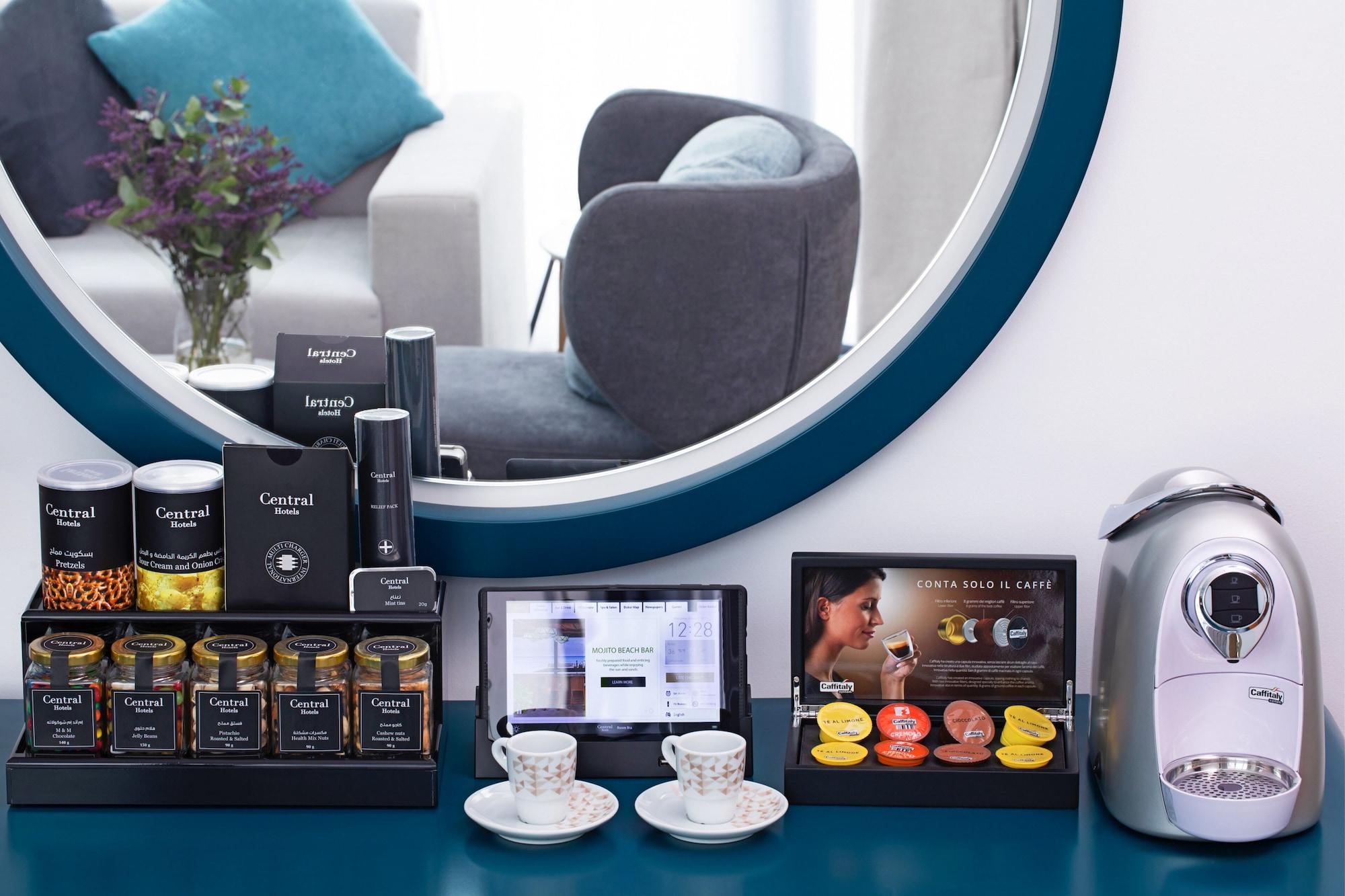 C Central Hotel And Resort The Palm Dubai Esterno foto A Nespresso coffee machine in a Nespresso machine station